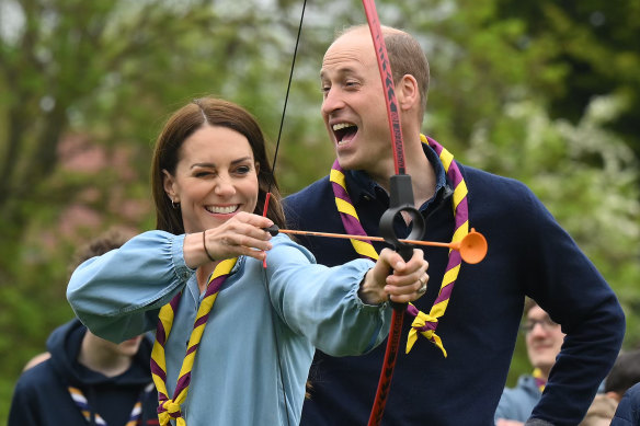 Watched by Prince William, Prince of Wales, Catherine, Princess of Wales, tries her hand at archery at a media event promoting volunteers last week.