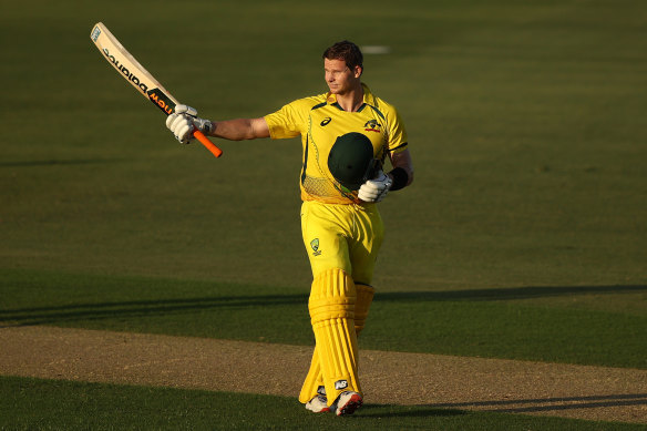 Steve Smith celebrates scoring a century during game three of the one -day internatio<em></em>nal series against New Zealand in Cairns on Sunday.