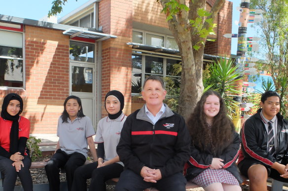 Hampton Park Secondary College students Fadak Jabbar, Vernon Santiago, Zahra Akhlaqee, principal Wayne Haworth, Paige Read, and Skyline Paileguto.
