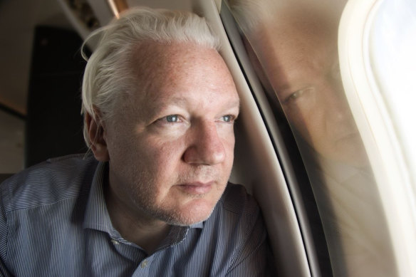 Julian Assange on board the plane that took him from Britain to Bangkok.