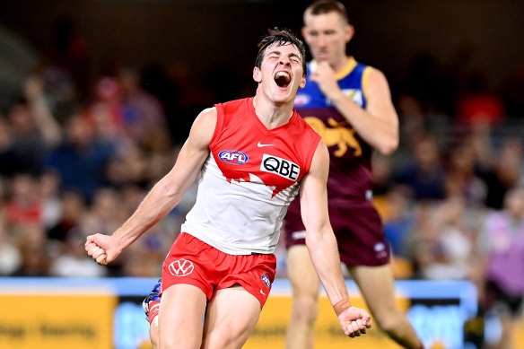 Errol Gulden of the Swans celebrates after kicking a goal.