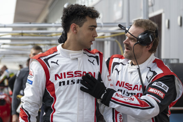 Archie Madekwe (left) plays a gamer who becomes a real-life racing car driver, while David Harbour plays his mentor in Gran Turismo.
