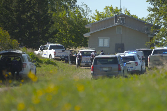 Canadian law enforcement personnel surrounded a residence on the James Smith Cree First Nation reservation in Saskatchewan, Canada.
