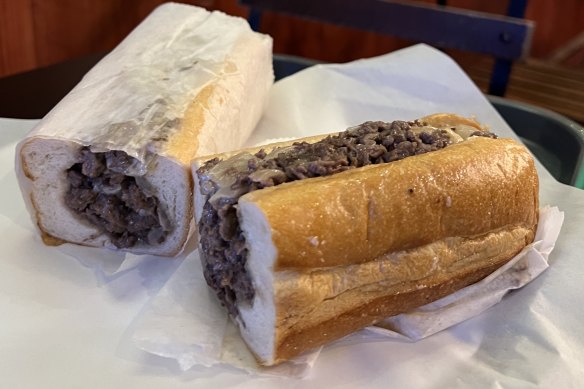 A Philly cheesesteak, a hoagie roll filled with beef strips and melted cheese.