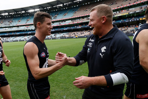 Sam Walsh, who barracked for the Brisbane Lions growing up, with coach Michael Voss after a Blues’ win.