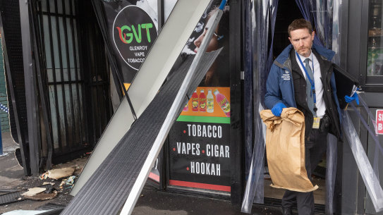 Police at the scene of a tobacco shop fire in Glenroy on October 9.