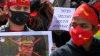 People rally in Melbourne on Tuesday to protest the arrest of Aung San Suu Kyi. 