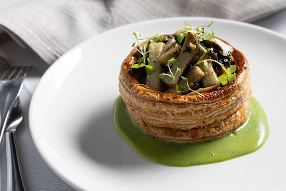 Mixed mushroom vol-au-vent with parsley coulis.