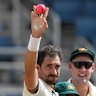 Mitchell Starc celebrates his five-wicket haul.