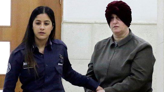 Malka Leifer, right, is brought to a courtroom in Jerusalem in 2018.