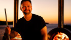 Lennox Hastie readies to do what he does best: prepare a barbecue like no other.