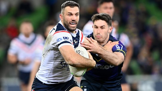 MELBOURNE, AUSTRALIA - AUGUST 26:  James Tedesco of the Roosters is tackled by Nick Meaney of the Storm during the round 24 NRL match between the Melbourne Storm and the Sydney Roosters at AAMI Park on August 26, 2022, in Melbourne, Australia. (Photo by Quinn Rooney/Getty Images)