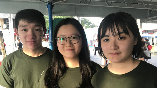 Edwin Mak, 23 and right, Michelle Shek, 19., performed a dramatisation of the Tiananmen Square crackdown for commuters at a Hong Kong ferry terminal on the evening of June 3.
