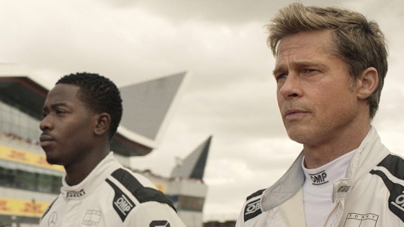 Damson Idris as Joshua Pearce and Brad Pitt as Sonny Hayes in a scene from “F1: The Movie.”