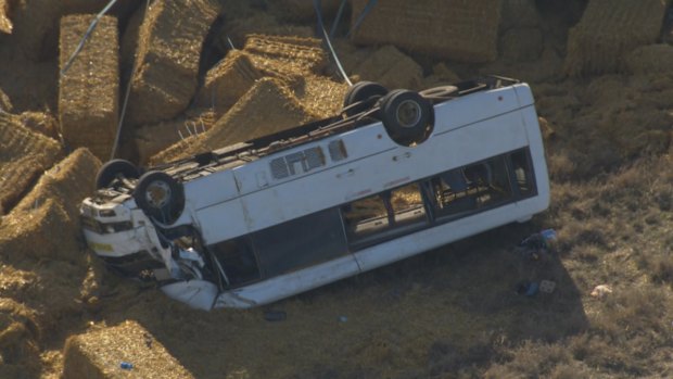 The bus driver was trapped for more than an hour after it rolled in country Victoria.