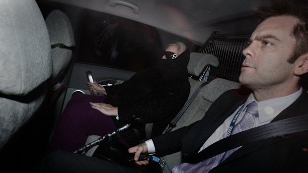 Judy Moran’s last ride from freedom in 2009. In police car with Stuart Bateson