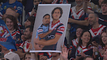 A fan made a sign of Mark Nawaqanitawase holding a baby-like Ronaldo Mulitalo for the semi final between the Sydney Roosters and Cronulla Sharks at Allianz Stadium.