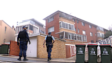 A woman in her 70s died and another occupant was treated for smoke inhalation.
