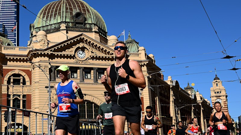 Teen arrested after woman hit by car outside Flinders Street Station near marathon route