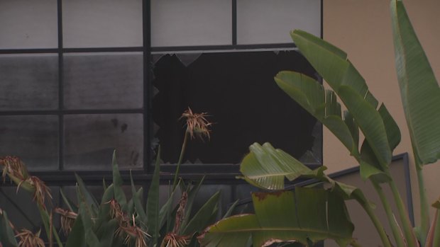 Teenagers smashed through a window to escape a burning home.