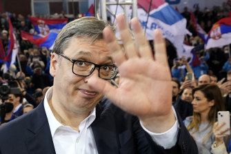 Serbian President Aleksandar Vucic waves to his supporters during a pre-election rally, in Belgrade.