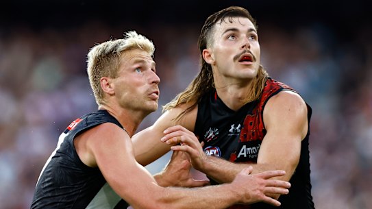 Tough call: The Bombers need to determine whether Sam Draper (right) and Todd Goldstein can work alongside fellow tall Peter Wright in Thursday’s Anzac Day clash.