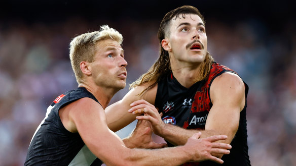 Tough call: The Bombers need to determine whether Sam Draper (right) and Todd Goldstein can work alongside fellow tall Peter Wright in Thursday’s Anzac Day clash.