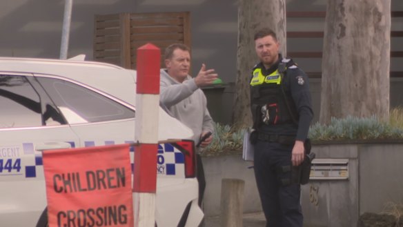 Michael Voss talks to police.