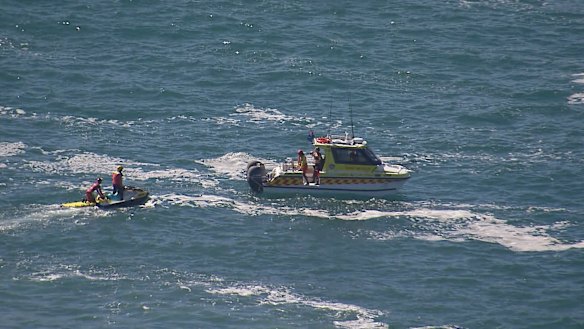 A fisherman is dead and a teenager is in hospital after they were swept off rocks at Wattamolla, south of Sydney.