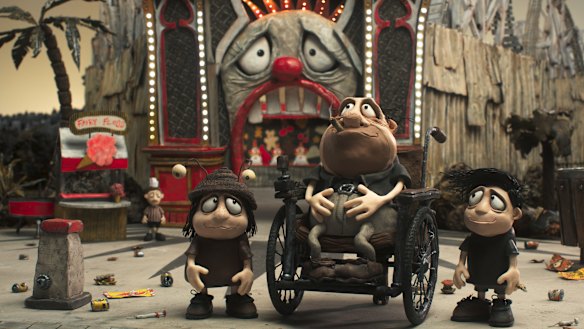 Grace Pudel (voiced by Sarah Snook), Percy (Dominique Pinon) and Gilbert (Kodi Smit-McPhee) at Luna Park in Memoir of a Snail.