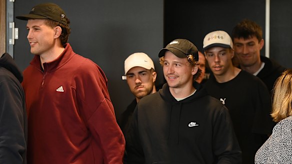 Some of the current St Kilda playing cohort arrive to watch Ross Lyon’s press conference.