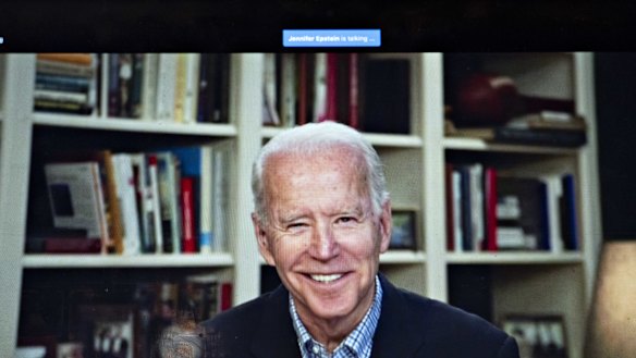 Former vice-president Joe Biden, 2020 Democratic presidential candidate, smiles during a virtual press briefing.
