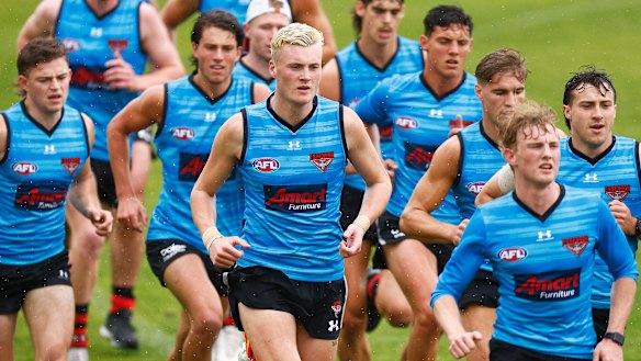 Nik Cox (centre) in action during an early pre-season running session.