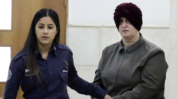Australian Malka Leifer, right, is brought to a courtroom in Jerusalem. in 2018.