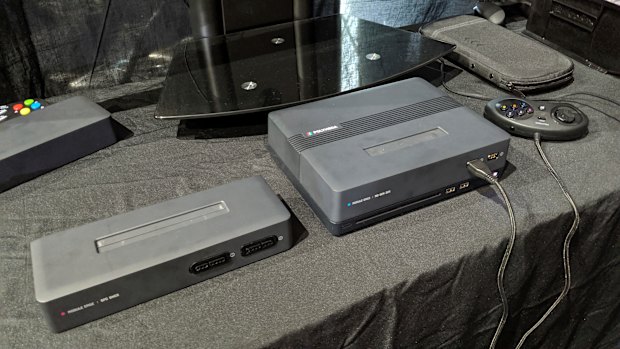 On the right, the Polymega base with the Mega Drive / Genesis / 32X module inserted. On the left, the Super Nintendo / Super Famicom module.