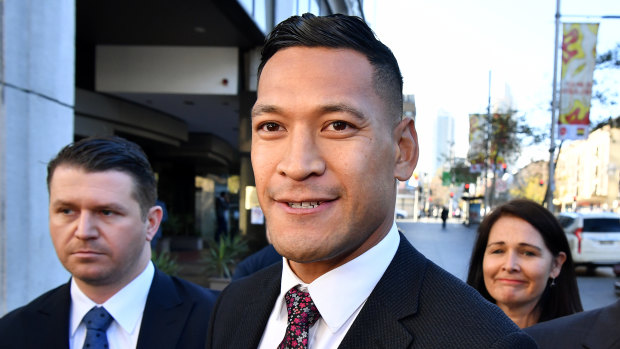 Israel Folau arrives for a conciliation hearing at the Fair Work Commission in Sydney.