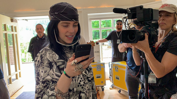 Billie Eilish filming her new music documentary Billie Eilish: The World’s a Little Blurry, out Friday on Apple TV+. 