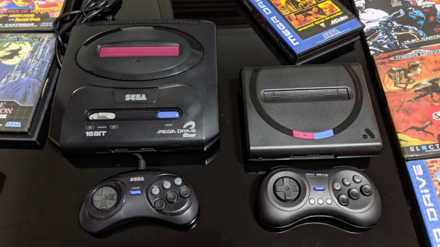The Mega Sg does not come with a controller, but works with anything that works with a Mega Drive. Pictured here is an original Mega Drive 2 and controller, next to the Mega Sg and a $35 wireless controller from 8bitdo.