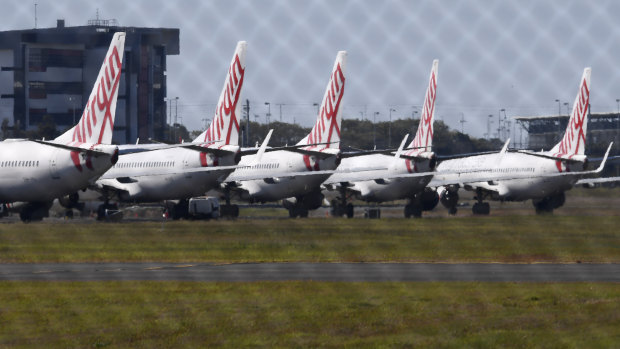 Virgin Australia planes at Brisbane Airport, grounded during the COVID-19 pandemic aviation downturn.