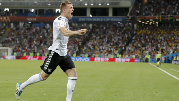 Toni Kroos celebrates after scoring the winner.