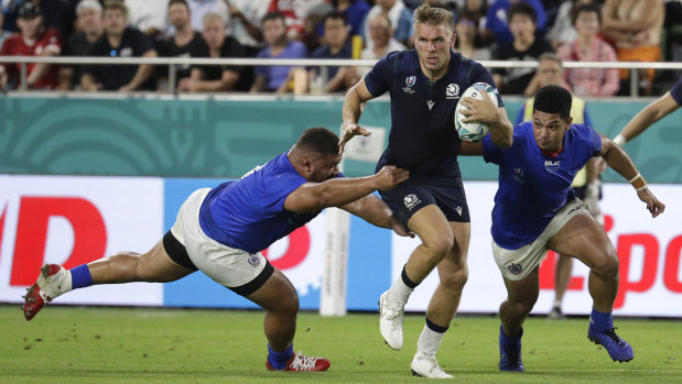 Scotland's Chris Harris runs at the Samoan defence.