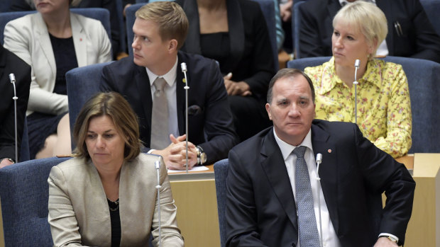Stefan Lofven (bottom right) attends parliament during a vote of confidence in the Swedish Parliament Riksdagen.