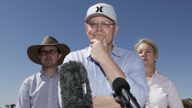 Prime Minister Scott Morrison, centre, with Agriculture Minister David Littleproud and Deputy Nationals leader Bridget McKenzie in Queensland last month.