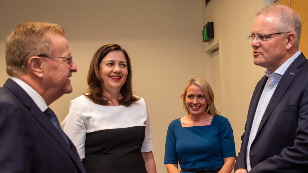 Prime Minster Scott Morrison greets Australian Olympic Committee president John Coates, Queensland Premier Annastacia Palaszczuk and Tourism Minister Kate Jones in Cairns.