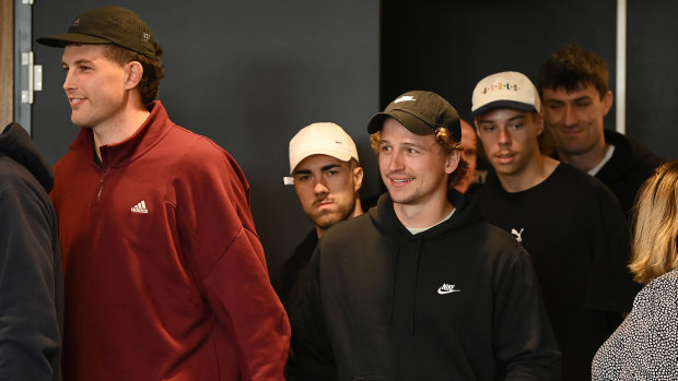 Some of the current St Kilda playing cohort arrive to watch Ross Lyon’s press conference.