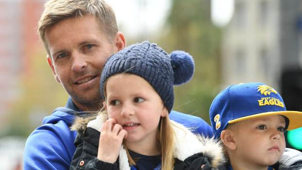 Mark LeCras with his children during the grand final parade.