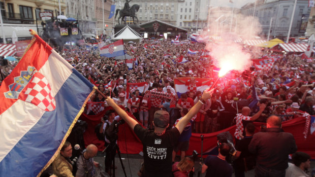 National fervour: Croatian fans watch their team win the semi-final against England in Zagreb.