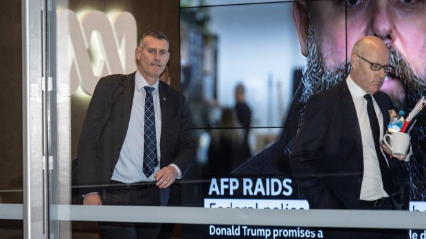 Australian Federal Police officers leave the ABC headquarters in Ultimo after the raid last June. 