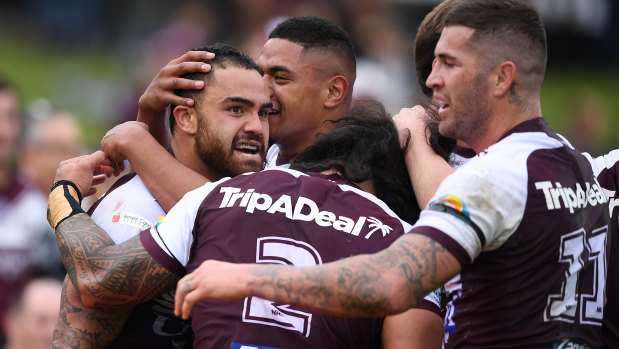 Dylan Walker celebrates a try for Manly in their commanding win over the Dragons.