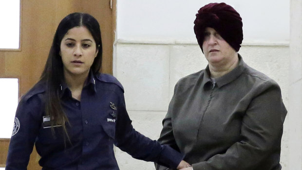 Malka Leifer, right, is brought to a courtroom in Jerusalem in 2018.